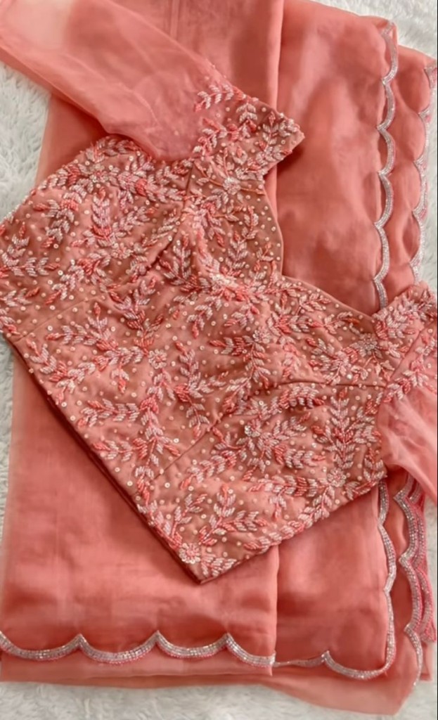 Peach saree with heavily embroidered leaf-pattern blouse and scalloped border